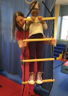 child climbing rope