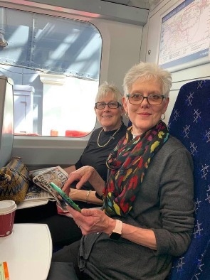 Maridith Geuder and her twin sister on a subway on vacation