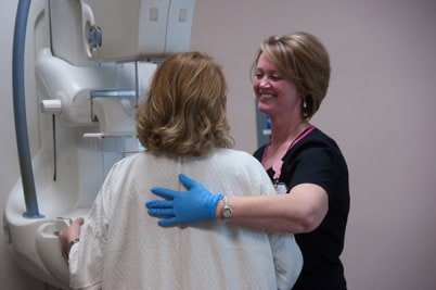 Patient receiving mammogram