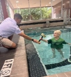 patient doing aquatic therapy with therapist