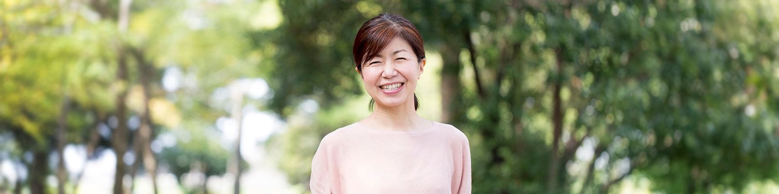 smiling woman wearing pink